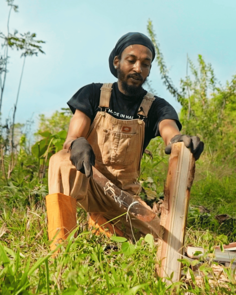 Sidney Etienne tending his Food forest in Haiti